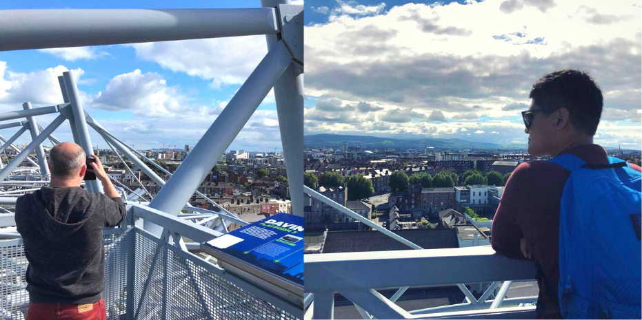 Man takes photo with mobile of Dublin City from Croke Park Stadium, Man looks at Dublin Skyline